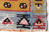 Vintage kilim rug in room decor setting, old rug, antique rug, pastel colors, faded colors, Turkish rug, vintage rug, soft rug, Portland, Oregon, rug store, rug shop, local shop, bold colors, bright colors, faded colors