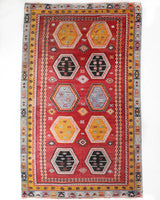 Vintage kilim rug in room decor setting, old rug, antique rug, pastel colors, faded colors, Turkish rug, vintage rug, soft rug, Portland, Oregon, rug store, rug shop, local shop, bold colors, bright colors, faded colors