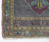 Vintage Turkish mini rug in room decor setting, old rug, antique rug, pastel colors, faded colors, Turkish rug, vintage rug, soft rug, Portland, Oregon, rug store, rug shop, local shop,  bright colors, bold colors
