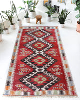 Vintage kilim rug in living room setting, old rug, antique rug, pastel colors, faded colors, Turkish rug, vintage rug, soft rug, Portland, Oregon, rug store, rug shop, local shop, earthy tones, earthy colors, warm colors