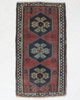 Vintage Turkish mini rug in room decor setting, old rug, antique rug, pastel colors, faded colors, Turkish rug, vintage rug, soft rug, Portland, Oregon, rug store, rug shop, local shop,  bright colors, bold colors