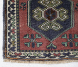 Vintage Turkish mini rug in room decor setting, old rug, antique rug, pastel colors, faded colors, Turkish rug, vintage rug, soft rug, Portland, Oregon, rug store, rug shop, local shop,  bright colors, bold colors