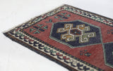 Vintage Turkish mini rug in room decor setting, old rug, antique rug, pastel colors, faded colors, Turkish rug, vintage rug, soft rug, Portland, Oregon, rug store, rug shop, local shop,  bright colors, bold colors