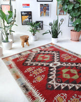 Vintage kilim rug in living room setting, old rug, antique rug, pastel colors, faded colors, Turkish rug, vintage rug, soft rug, Portland, Oregon, rug store, rug shop, local shop, earthy tones, earthy colors, warm colorsVintage kilim rug in living room setting, old rug, antique rug, pastel colors, faded colors, Turkish rug, vintage rug, soft rug, Portland, Oregon, rug store, rug shop, local shop, earthy tones, earthy colors, warm colors