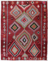 Vintage kilim rug in living room setting, old rug, antique rug, pastel colors, faded colors, Turkish rug, vintage rug, soft rug, Portland, Oregon, rug store, rug shop, local shop, earthy tones, earthy colors, warm colors