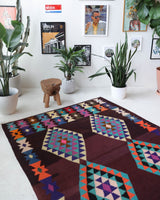 Vintage kilim rug in living room setting, old rug, antique rug, pastel colors, faded colors, Turkish rug, vintage rug, soft rug, Portland, Oregon, rug store, rug shop, local shop, earthy tones, earthy colors, warm colors