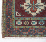 Vintage Turkish mini rug in room decor setting, old rug, antique rug, pastel colors, faded colors, Turkish rug, vintage rug, soft rug, Portland, Oregon, rug store, rug shop, local shop,  bright colors, bold colors