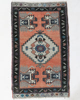 Vintage Turkish mini rug in room decor setting, old rug, antique rug, pastel colors, faded colors, Turkish rug, vintage rug, soft rug, Portland, Oregon, rug store, rug shop, local shop,  bright colors, bold colors