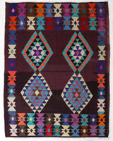 Vintage kilim rug in living room setting, old rug, antique rug, pastel colors, faded colors, Turkish rug, vintage rug, soft rug, Portland, Oregon, rug store, rug shop, local shop, earthy tones, earthy colors, warm colors