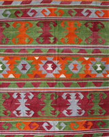 Vintage kilim rug in living room setting, old rug, antique rug, pastel colors, faded colors, Turkish rug, vintage rug, soft rug, Portland, Oregon, rug store, rug shop, local shop, earthy tones, earthy colors, warm colors