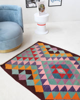 Vintage mini kilim rug in room decor setting, kilim, Turkish rug, vintage rug, portland, rug shop, bright colors, wild shaman, soft rug, bold color, Portland, Oregon, rug store, rug shop, local shop