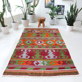 Vintage kilim rug in living room setting, old rug, antique rug, pastel colors, faded colors, Turkish rug, vintage rug, soft rug, Portland, Oregon, rug store, rug shop, local shop, earthy tones, earthy colors, warm colors