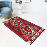 Vintage mini kilim rug in room decor setting, kilim, Turkish rug, vintage rug, portland, rug shop, bright colors, wild shaman, soft rug, bold color, Portland, Oregon, rug store, rug shop, local shop