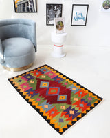 Vintage mini kilim rug in room decor setting, kilim, Turkish rug, vintage rug, portland, rug shop, bright colors, wild shaman, soft rug, bold color, Portland, Oregon, rug store, rug shop, local shop
