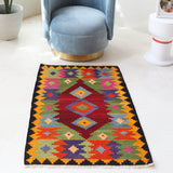 Vintage mini kilim rug in room decor setting, kilim, Turkish rug, vintage rug, portland, rug shop, bright colors, wild shaman, soft rug, bold color, Portland, Oregon, rug store, rug shop, local shop