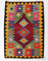 Vintage mini kilim rug in room decor setting, kilim, Turkish rug, vintage rug, portland, rug shop, bright colors, wild shaman, soft rug, bold color, Portland, Oregon, rug store, rug shop, local shop