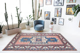 Vintage Turkish rug in a living room setting, Area rug in a living room setting, pile rug, Turkish rug, old rug, antique rug, pastel colors, faded colors, Turkish rug, vintage rug, soft rug, Portland, Oregon, rug store, rug shop, local shop, distressed rug, worn out rug