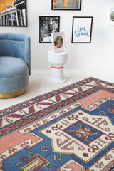 Vintage Turkish rug in a living room setting, Area rug in a living room setting, pile rug, Turkish rug, old rug, antique rug, pastel colors, faded colors, Turkish rug, vintage rug, soft rug, Portland, Oregon, rug store, rug shop, local shop, distressed rug, worn out rug