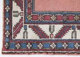 Vintage Turkish rug in a living room setting, Area rug in a living room setting, pile rug, Turkish rug, old rug, antique rug, pastel colors, faded colors, Turkish rug, vintage rug, soft rug, Portland, Oregon, rug store, rug shop, local shop, distressed rug, worn out rug