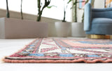 Vintage Turkish rug in a living room setting, Area rug in a living room setting, pile rug, Turkish rug, old rug, antique rug, pastel colors, faded colors, Turkish rug, vintage rug, soft rug, Portland, Oregon, rug store, rug shop, local shop, distressed rug, worn out rug