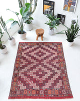 Vintage kilim rug in living room setting, old rug, antique rug, pastel colors, faded colors, Turkish rug, vintage rug, soft rug, Portland, Oregon, rug store, rug shop, local shop, earthy tones, earthy colors, warm colors