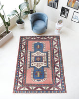 Vintage Turkish rug in a living room setting, Area rug in a living room setting, pile rug, Turkish rug, old rug, antique rug, pastel colors, faded colors, Turkish rug, vintage rug, soft rug, Portland, Oregon, rug store, rug shop, local shop, distressed rug, worn out rug