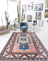 Vintage Turkish rug in a living room setting, Area rug in a living room setting, pile rug, Turkish rug, old rug, antique rug, pastel colors, faded colors, Turkish rug, vintage rug, soft rug, Portland, Oregon, rug store, rug shop, local shop, distressed rug, worn out rug