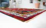 Vintage Turkish rug in a living room setting, pile rug, Turkish rug, vintage rug, portland, rug shop, bright colors, wild shaman, soft rug, bold color, Portland, Oregon, rug store, rug shop, local shop, shag rug, shaggy, plush,tulu rugs