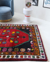 Vintage Turkish rug in a living room setting, pile rug, Turkish rug, vintage rug, portland, rug shop, bright colors, wild shaman, soft rug, bold color, Portland, Oregon, rug store, rug shop, local shop, shag rug, shaggy, plush,tulu rugs