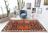 Vintage Turkish rug in a living room setting, pile rug, Turkish rug, vintage rug, portland, rug shop, bright colors, wild shaman, soft rug, bold color, Portland, Oregon, rug store, rug shop, local shop, shag rug, shaggy, plush,tulu rugs