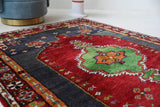 Vintage Turkish rug in a living room setting, pile rug, Turkish rug, vintage rug, portland, rug shop, bright colors, wild shaman, soft rug, bold color, Portland, Oregon, rug store, rug shop, local shop, shag rug, shaggy, plush,tulu rugs
