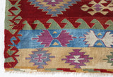 Vintage kilim rug in room decor setting, old rug, antique rug, pastel colors, faded colors, Turkish rug, vintage rug, soft rug, Portland, Oregon, rug store, rug shop, local shop, bold colors, bright colors, faded colors
