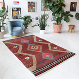 Vintage Turkish rug in a living room setting, pile rug, Turkish rug, vintage rug, portland, rug shop, bright colors, wild shaman, soft rug, bold color, Portland, Oregon, rug store, rug shop, local shop, antique rug