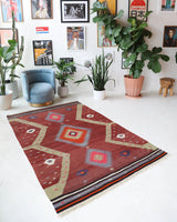 Vintage Turkish rug in a living room setting, pile rug, Turkish rug, vintage rug, portland, rug shop, bright colors, wild shaman, soft rug, bold color, Portland, Oregon, rug store, rug shop, local shop, antique rug