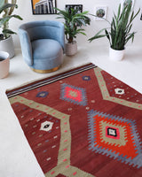 Vintage Turkish rug in a living room setting, pile rug, Turkish rug, vintage rug, portland, rug shop, bright colors, wild shaman, soft rug, bold color, Portland, Oregon, rug store, rug shop, local shop, antique rug