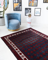 Vintage Turkish rug in a living room setting, pile rug, Turkish rug, vintage rug, portland, rug shop, bright colors, wild shaman, soft rug, bold color, Portland, Oregon, rug store, rug shop, local shop, antique rug