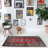 Vintage Turkish rug in a living room setting, pile rug, Turkish rug, vintage rug, portland, rug shop, bright colors, wild shaman, soft rug, bold color, Portland, Oregon, rug store, rug shop, local shop