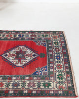 Vintage Turkish rug in a living room setting, pile rug, Turkish rug, vintage rug, portland, rug shop, bright colors, wild shaman, soft rug, bold color, Portland, Oregon, rug store, rug shop, local shop