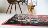 Vintage Turkish rug in a living room setting, pile rug, Turkish rug, vintage rug, portland, rug shop, bright colors, wild shaman, soft rug, bold color, Portland, Oregon, rug store, rug shop, local shop