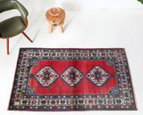 Vintage Turkish rug in a living room setting, pile rug, Turkish rug, vintage rug, portland, rug shop, bright colors, wild shaman, soft rug, bold color, Portland, Oregon, rug store, rug shop, local shop