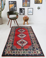 Vintage Turkish rug in a living room setting, pile rug, Turkish rug, vintage rug, portland, rug shop, bright colors, wild shaman, soft rug, bold color, Portland, Oregon, rug store, rug shop, local shop