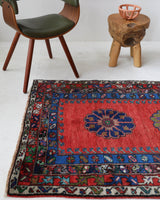 Vintage Turkish rug in a living room setting, pile rug, Turkish rug, vintage rug, portland, rug shop, bright colors, wild shaman, soft rug, bold color, Portland, Oregon, rug store, rug shop, local shop