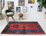 Vintage Turkish rug in a living room setting, pile rug, Turkish rug, vintage rug, portland, rug shop, bright colors, wild shaman, soft rug, bold color, Portland, Oregon, rug store, rug shop, local shop