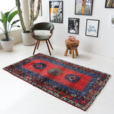 Vintage Turkish rug in a living room setting, pile rug, Turkish rug, vintage rug, portland, rug shop, bright colors, wild shaman, soft rug, bold color, Portland, Oregon, rug store, rug shop, local shop