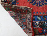 Vintage Turkish rug in a living room setting, pile rug, Turkish rug, vintage rug, portland, rug shop, bright colors, wild shaman, soft rug, bold color, Portland, Oregon, rug store, rug shop, local shop