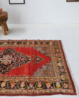 Vintage Turkish rug in a living room setting, pile rug, Turkish rug, vintage rug, portland, rug shop, bright colors, wild shaman, soft rug, bold color, Portland, Oregon, rug store, rug shop, local shop