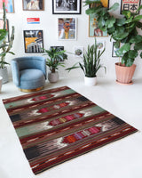 Vintage kilim rug in living room setting, bright colors, wild shaman, soft rug, bold color, Portland, Oregon, rug store, rug shop, local shop, vintage rug, modern kilim, warm colors