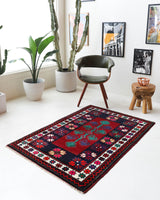 Vintage Turkish rug in a living room setting, pile rug, Turkish rug, vintage rug, portland, rug shop, bright colors, wild shaman, soft rug, bold color, Portland, Oregon, rug store, rug shop, local shop