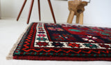 Vintage Turkish rug in a living room setting, pile rug, Turkish rug, vintage rug, portland, rug shop, bright colors, wild shaman, soft rug, bold color, Portland, Oregon, rug store, rug shop, local shop