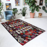 Vintage kilim rug in living room setting, bright colors, wild shaman, soft rug, bold color, Portland, Oregon, rug store, rug shop, local shop, vintage rug, modern kilim, warm colors